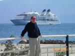 Danny in Agios Nikolaos, Crete with a view of Seabourn Odyssey