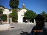 Our tour guide and a church at the entrance to St. Paul de Vence