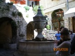 Our tour guide pointing out the town fountain St. Paul de Vence