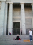 Kathy exhausted on steps of Cathedral after day at Museo del Prado